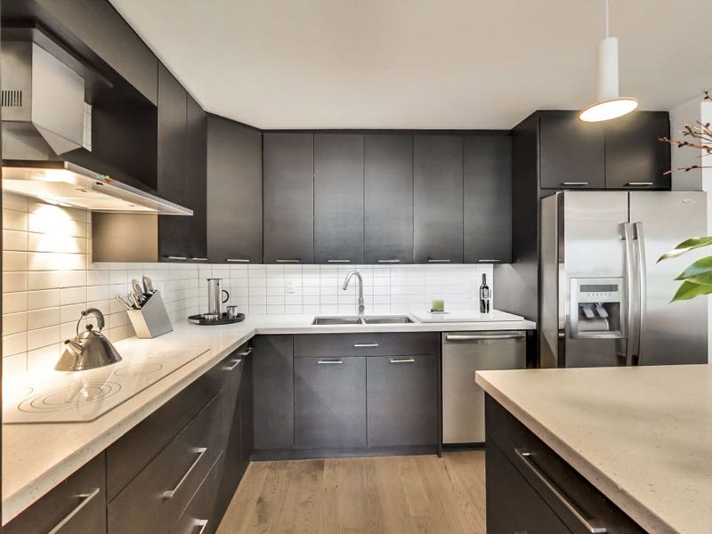 401 queens quay w kitchen with stone counters and upgraded appliances