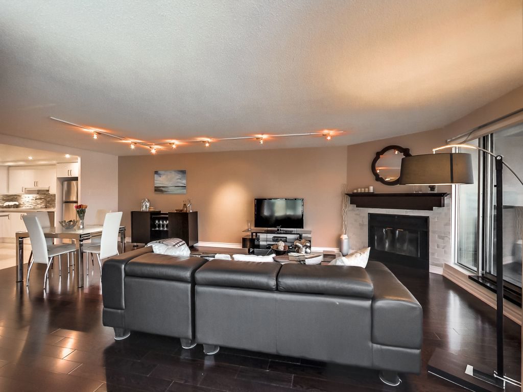 401 Queens Quay W 503 living room and dining room wood burning fireplace and walkout to balcony