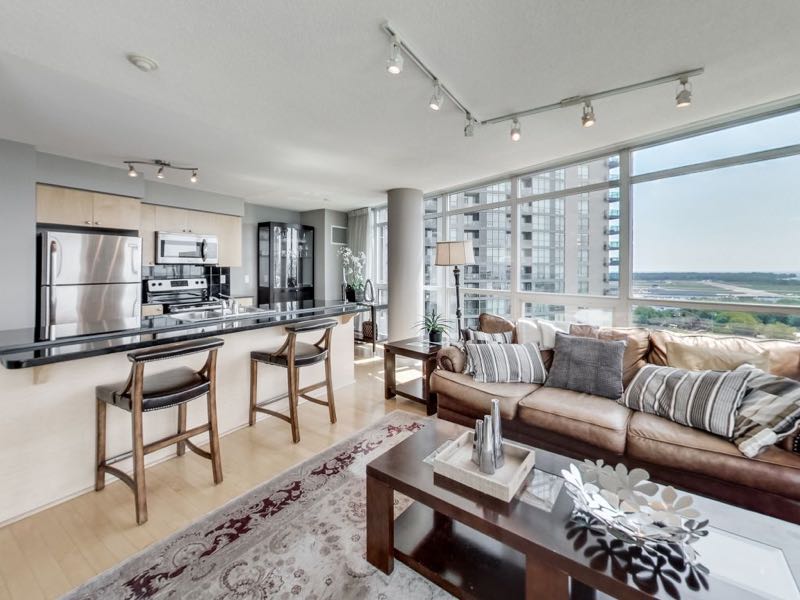 231 Fort York Blvd 1603 living area adjoining breakfast bar view a wall of windows