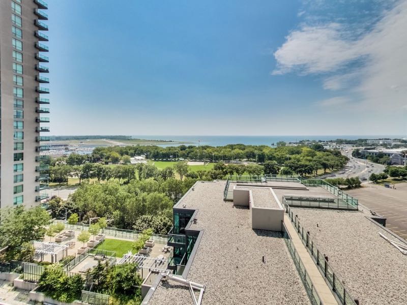 231 Fort York Blvd 1603 view overlooking secondary rooftop deck greenspace and Lake Ontario