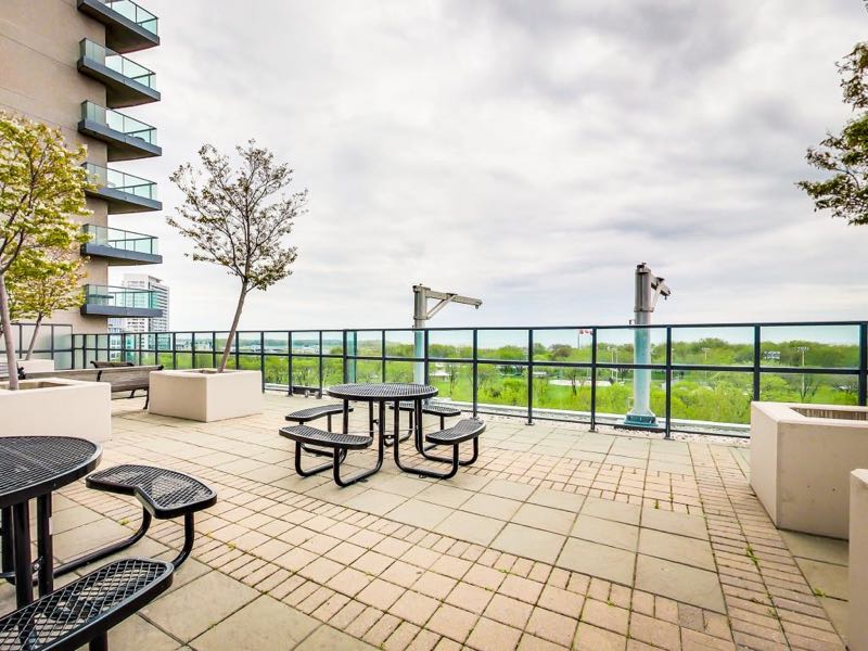 231 Fort York Blvd seating areas on rooftop deck beside BBQs